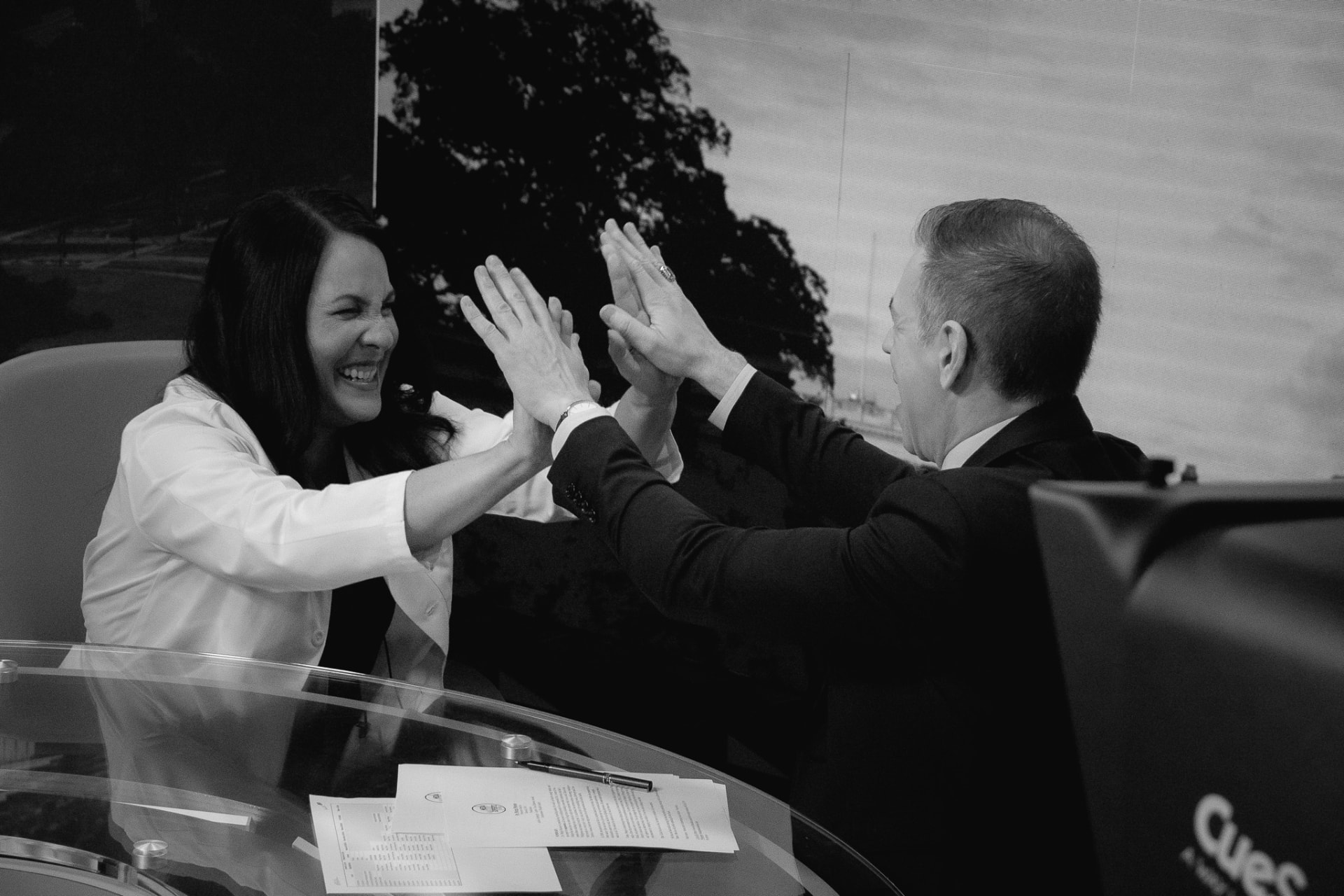 Dr. Marga Macias high-fives her coach after an on-camera interview at Media Mastery Experts LIVE!