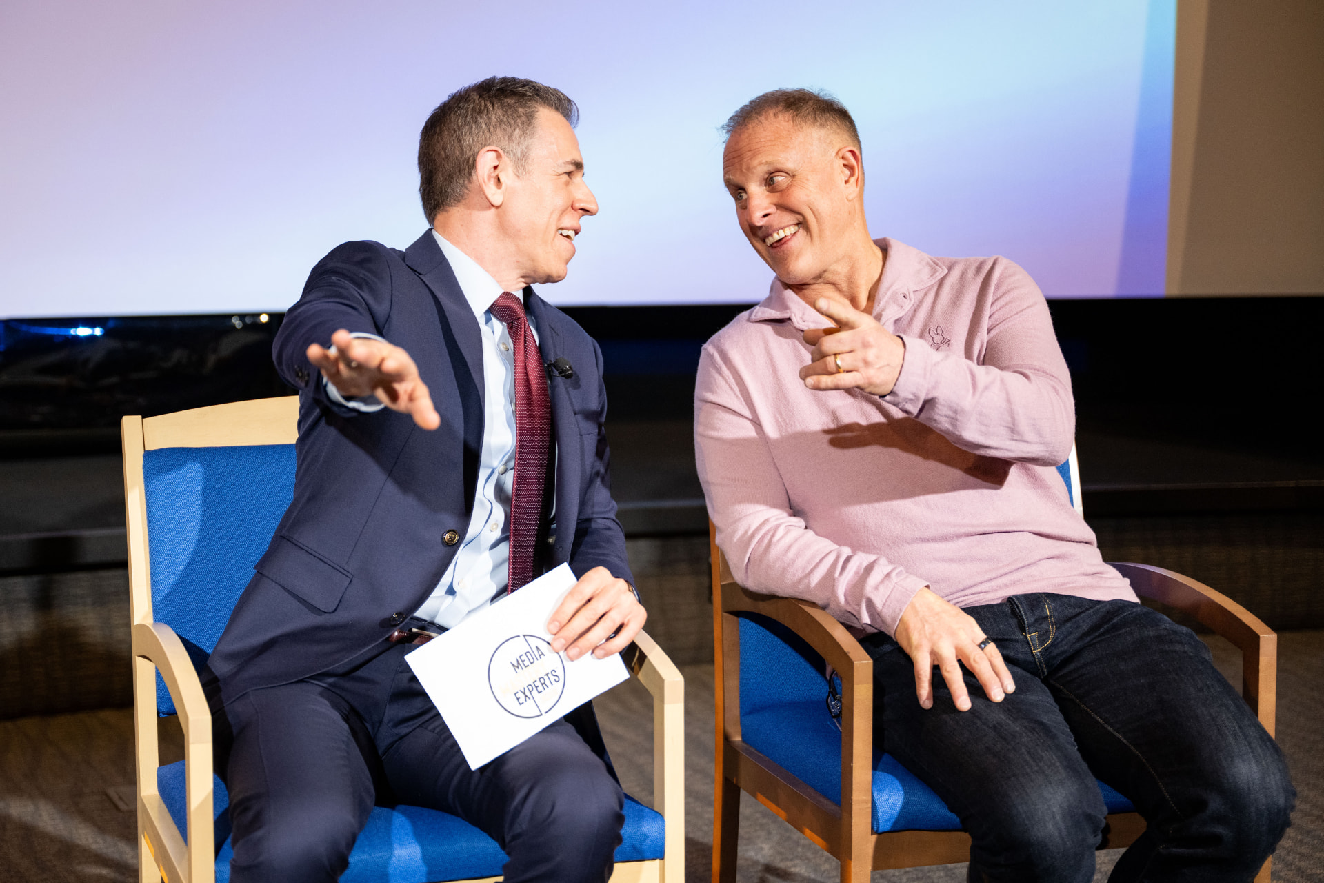 Mark Albert and a guest exchanging ideas during a live panel