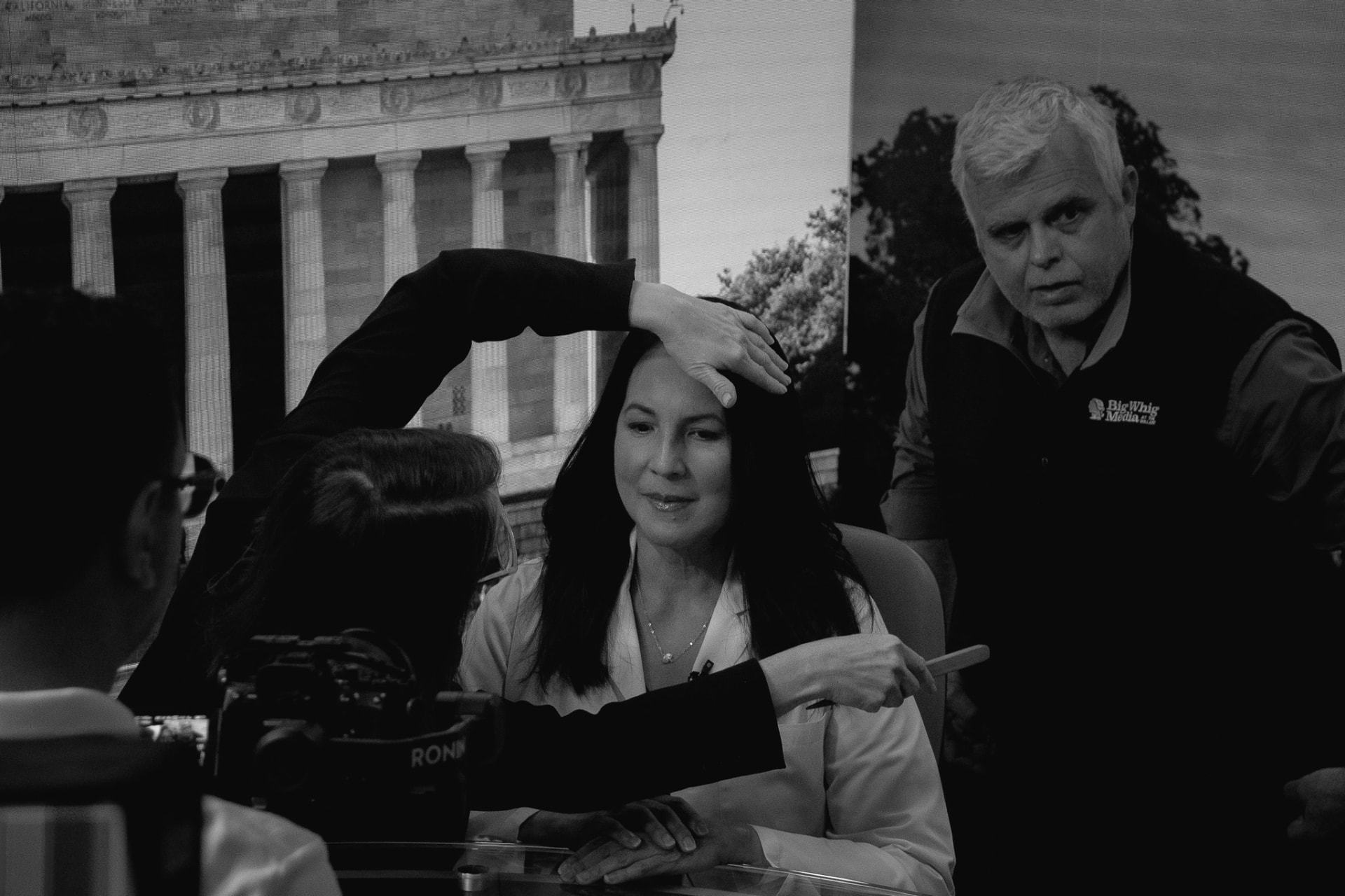Dr. Marga Macias in hair and makeup on the studio set before a mock news interview