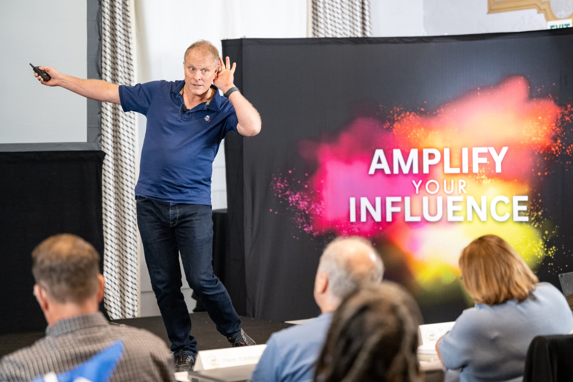Co-founder John Bates coaching on stage during a Media Mastery Experts LIVE! workshop